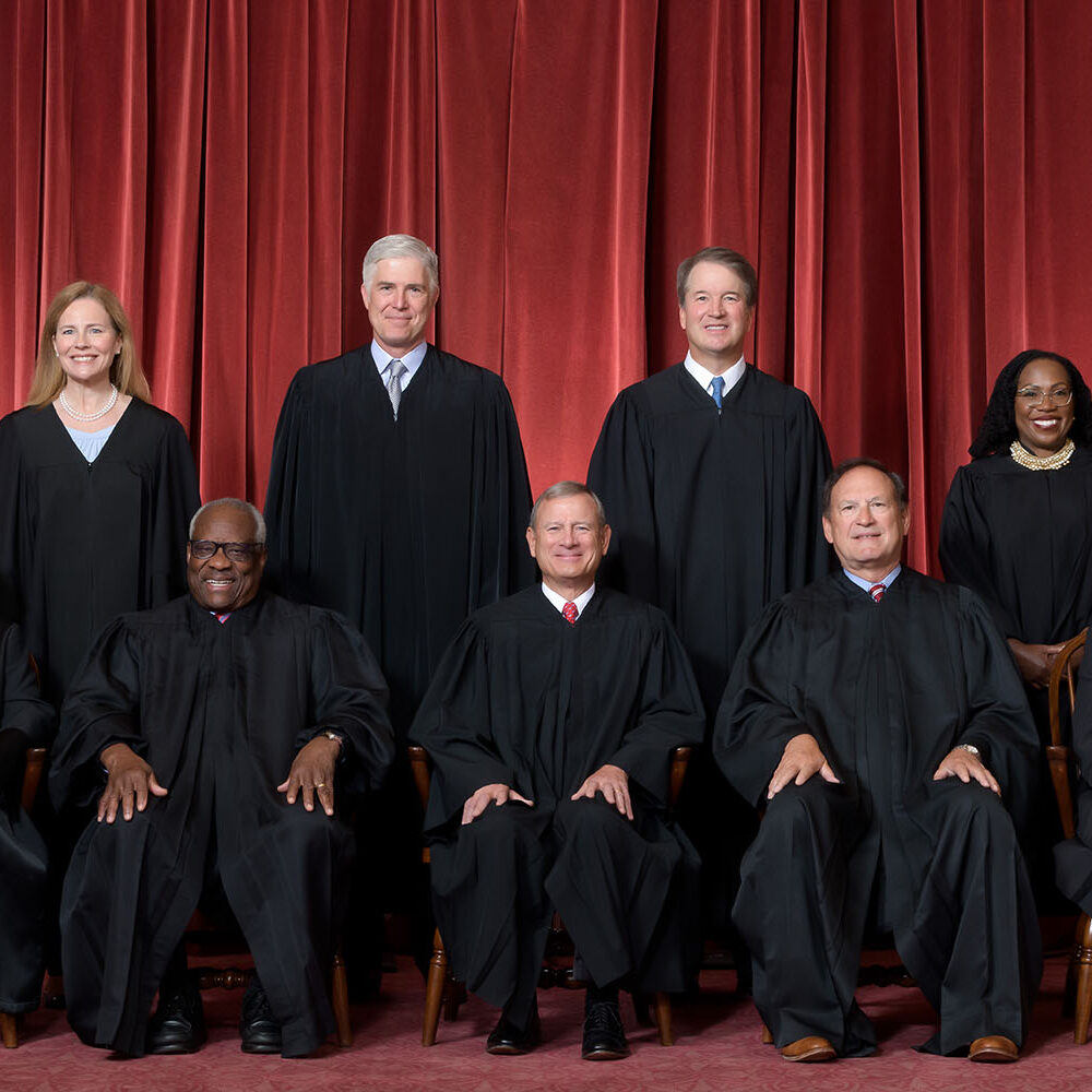 Formal group photograph of the Supreme Court as it was been comprised on June 30, 2022 after Justice Ketanji Brown Jackson joined the Court.  The Justices are posed in front of red velvet drapes and arranged by seniority, with five seated and four standing.

Seated from left are Justices Sonia Sotomayor, Clarence Thomas, Chief Justice John G. Roberts, Jr., and Justices Samuel A. Alito and Elena Kagan.  
Standing from left are Justices Amy Coney Barrett, Neil M. Gorsuch, Brett M. Kavanaugh, and Ketanji Brown Jackson.

Credit: Fred Schilling, Collection of the Supreme Court of the United States